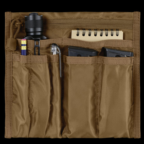 The Condor VA Organizer is a tan nylon pouch for EDC, designed to hold a flashlight, pencil, pen, metal tool, two black magazines, and a small spiral notebook.